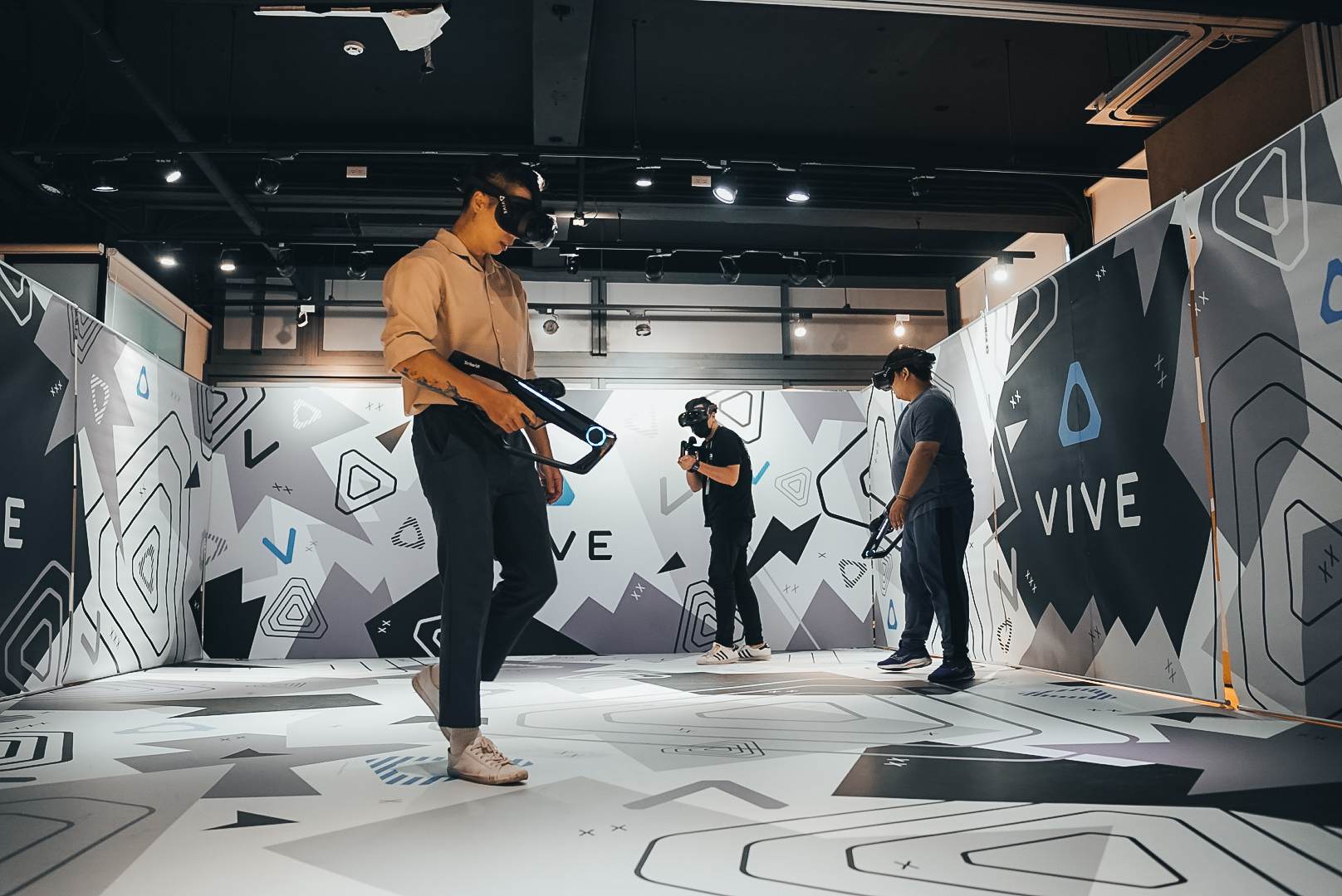 Wearing the VIVE Focus Vision for Location-Based Entertainment, players can engage in a space shootout right in the venue.